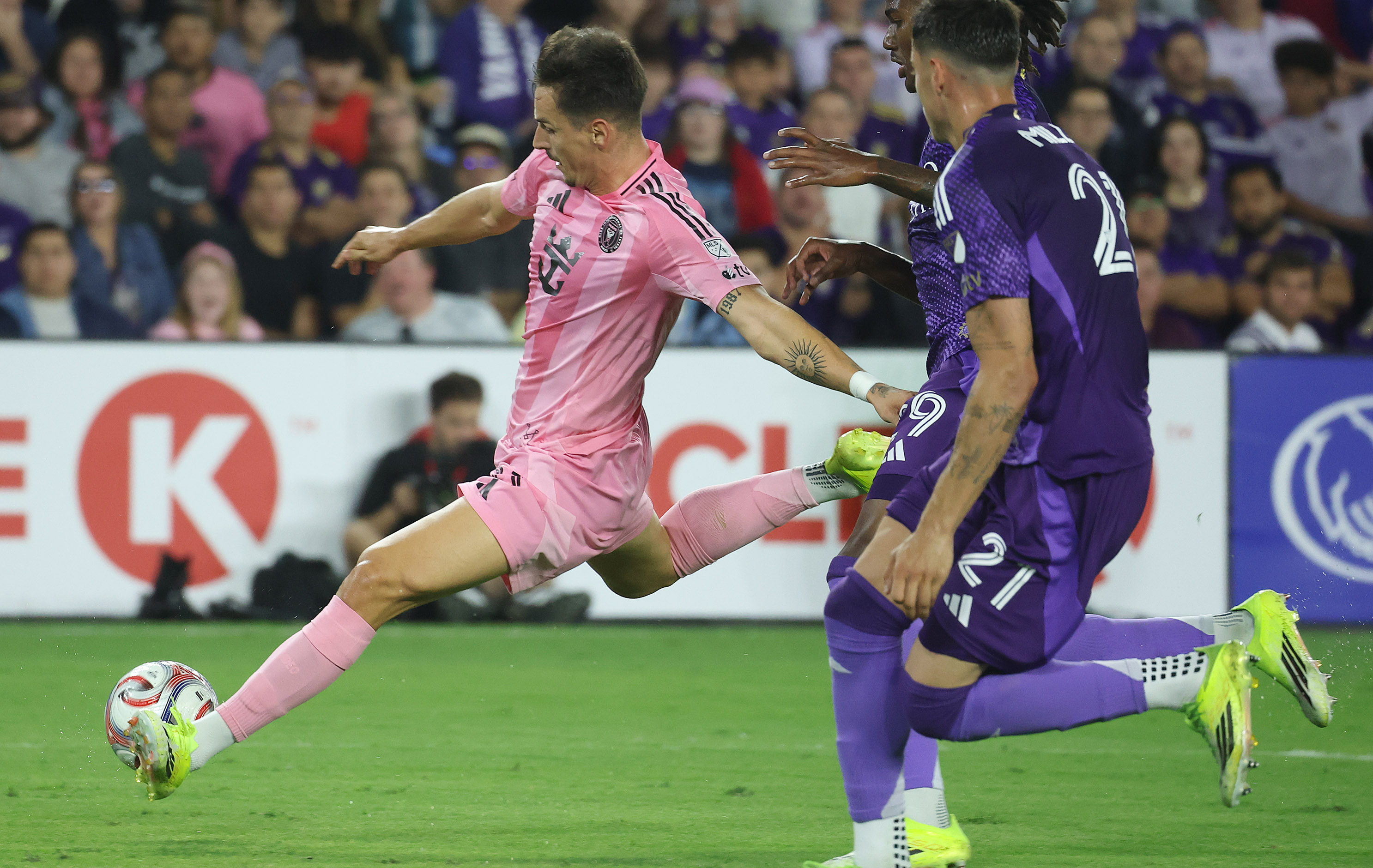 Miami player Tadeo Allende (left) kicks during the Inter Miami...