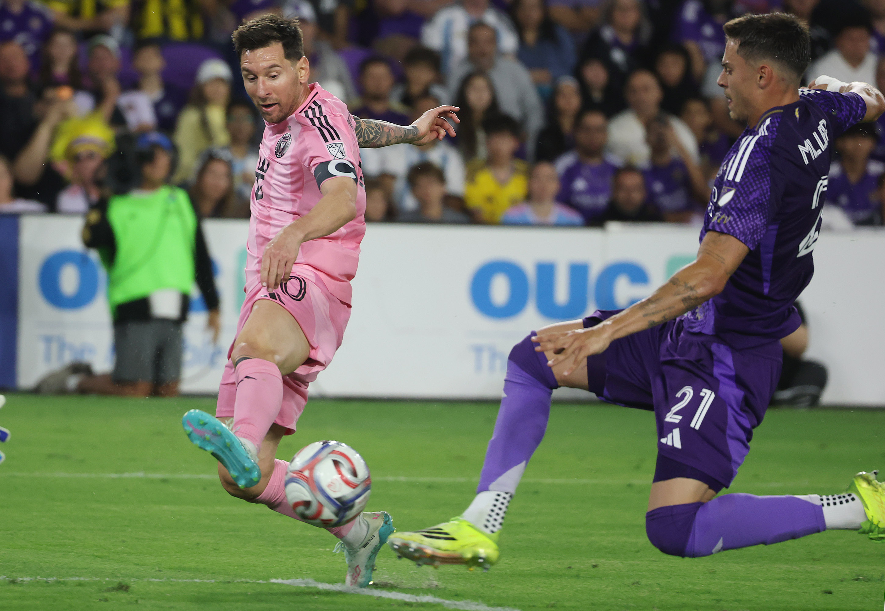 Miami player Lionel Messi (10) moves the ball past Orlando...