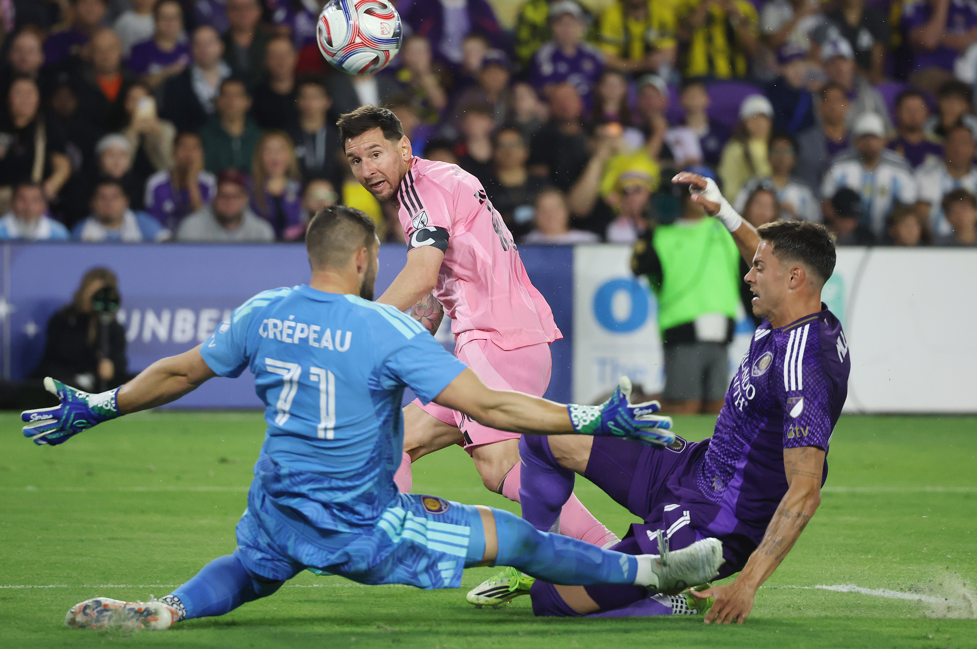 Orlando goalkeeper Maxime Crepeau (71) and Orlando player Nolan Miller...