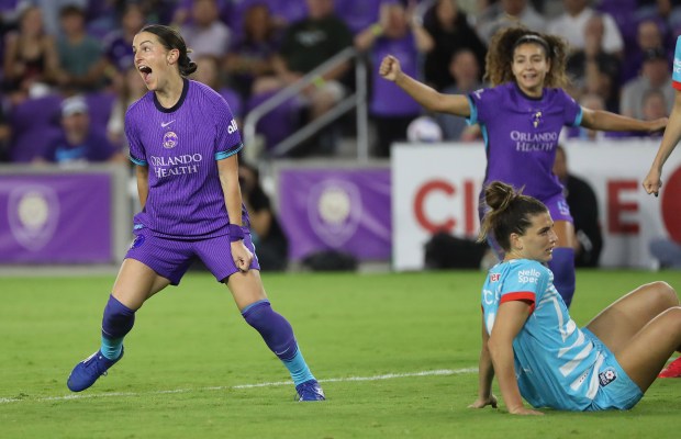 Orlando Pride player Haley McCutcheon, left, celebrates after scoring a goal during the Chicago Stars at Orlando Pride NWSL match in Orlando on Friday, March 14, 2025. Orlando won the match 6-0. (Stephen M. Dowell/Orlando Sentinel)