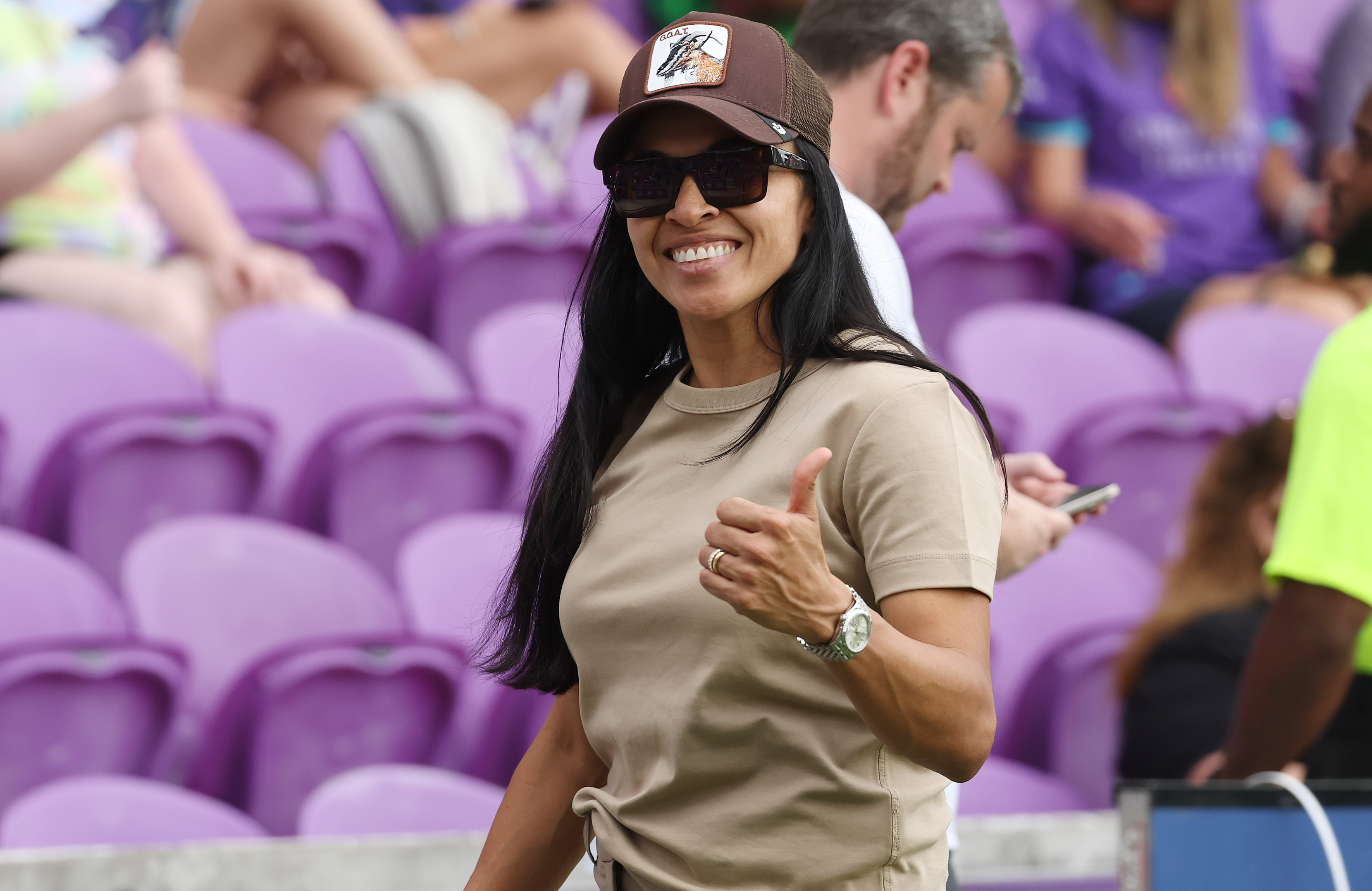 Orlando player Marta smiles on the sidelines before the start...