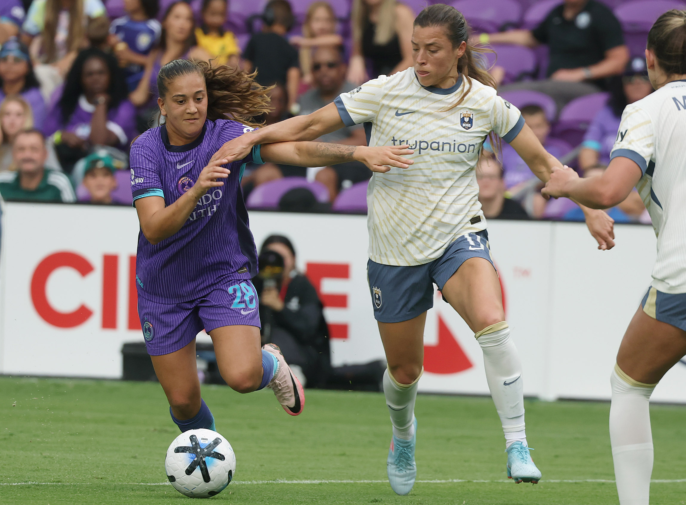 Orlando player Summer Yates (28) battles Seattle player Sofia Huerta...