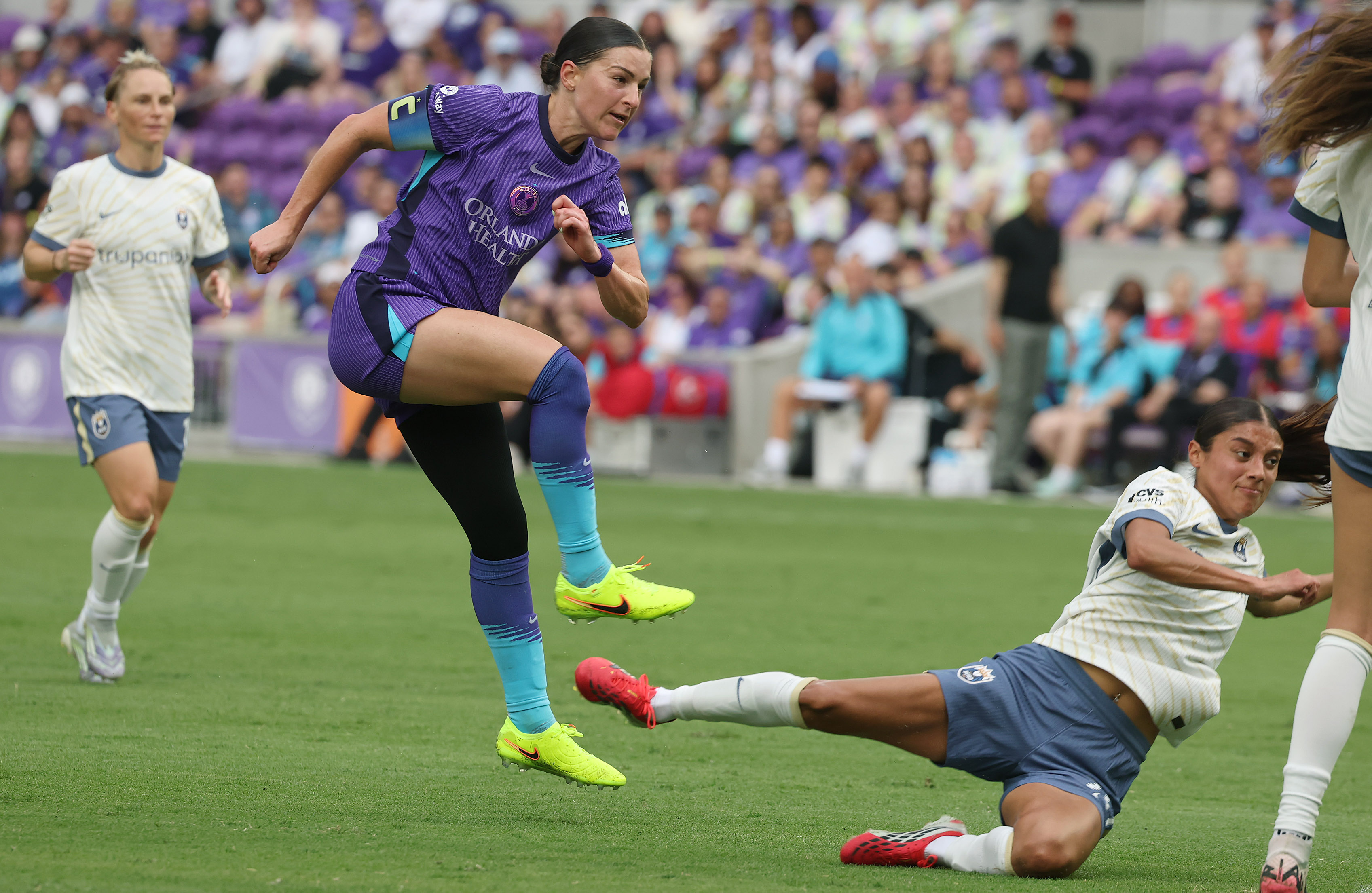 Orlando player Haley McCutcheon (middle) kicks at goal during the...