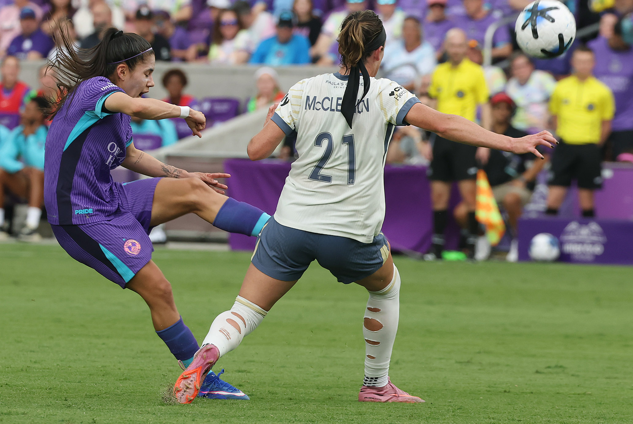 Orlando player Jacqueline Ovalle (left) kicks past Seattle player Phoebe...