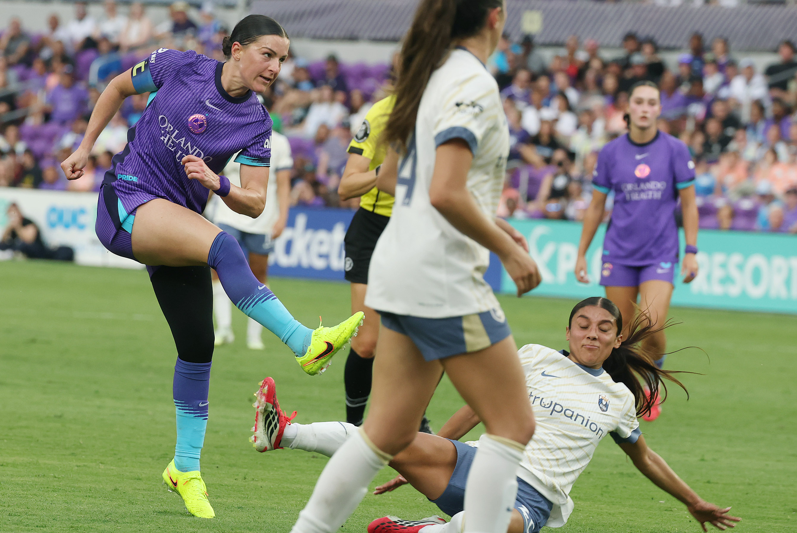 Orlando player Haley McCutcheon (left) kicks at goal during the...