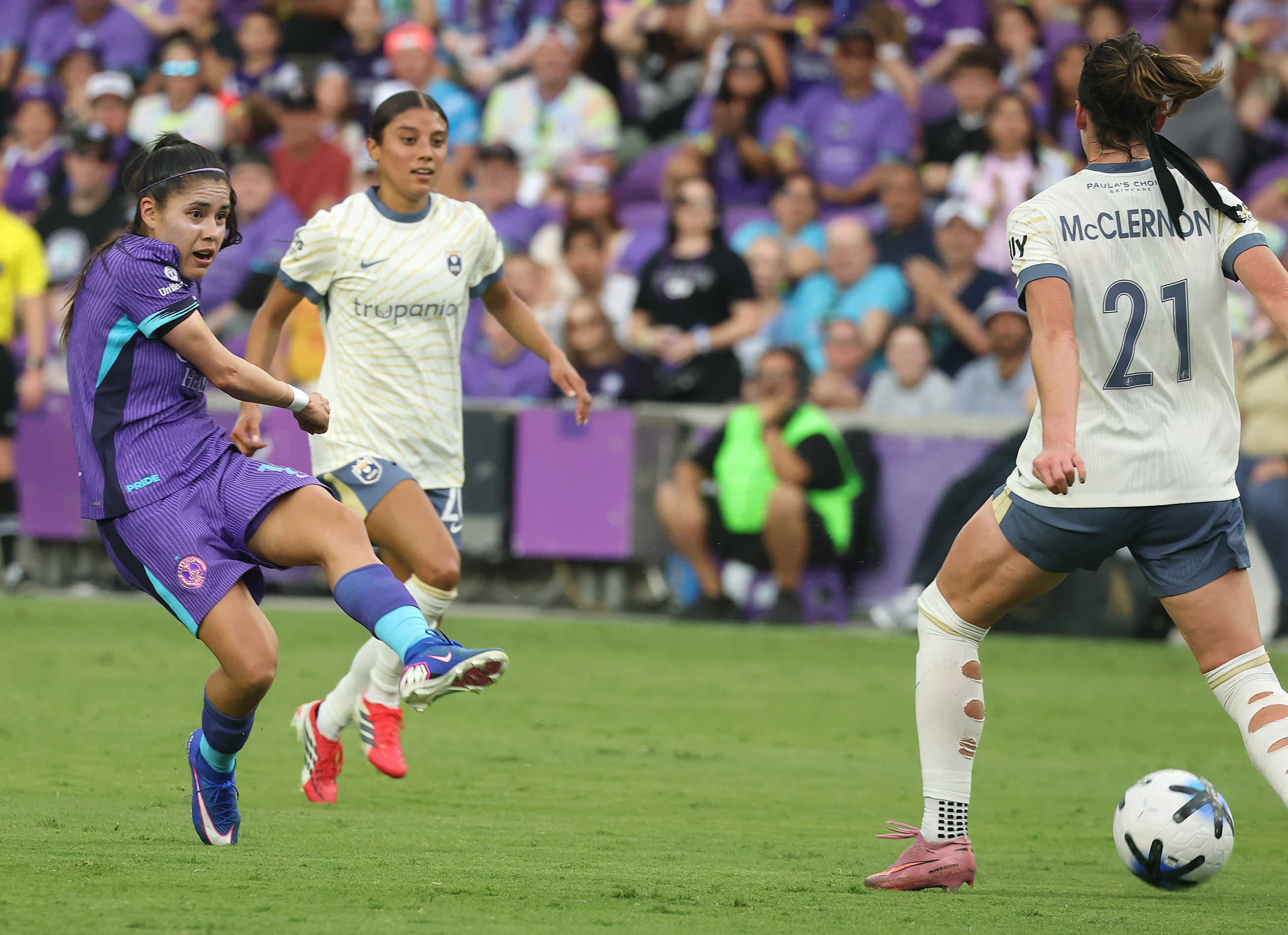 Orlando player Jacqueline Ovalle (left) kicks past Seattle player Phoebe...