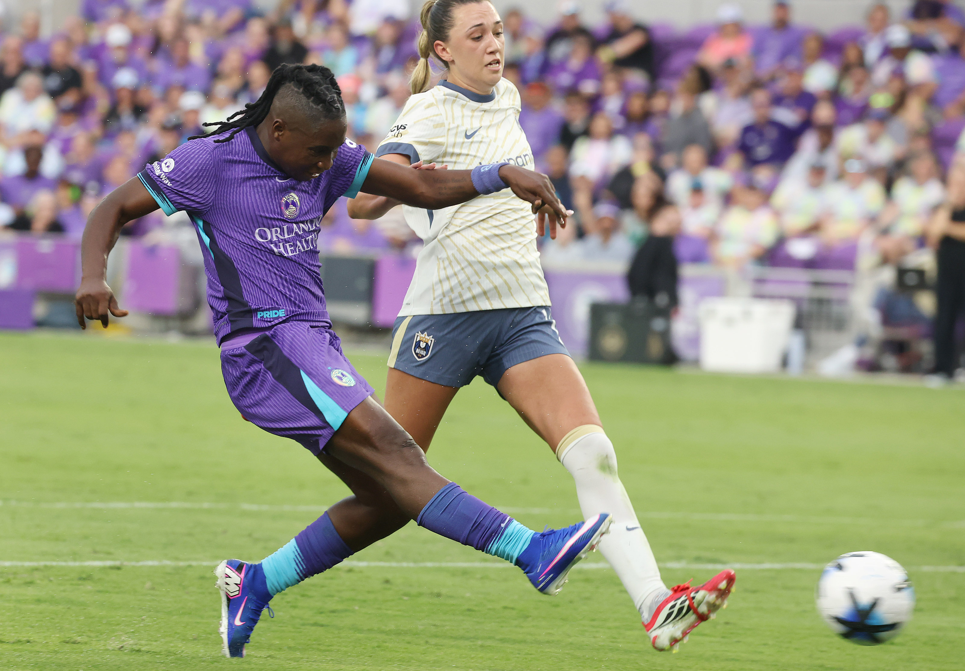 Orlando player Barbra Banda (left) kicks at goal during the...