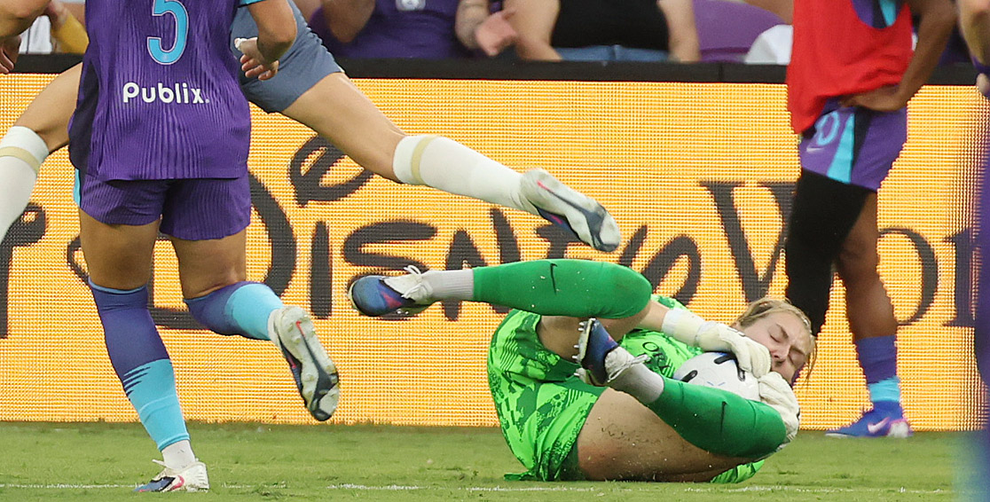 Orlando goalkeeper Anna Moorhouse slides to make a stop during...