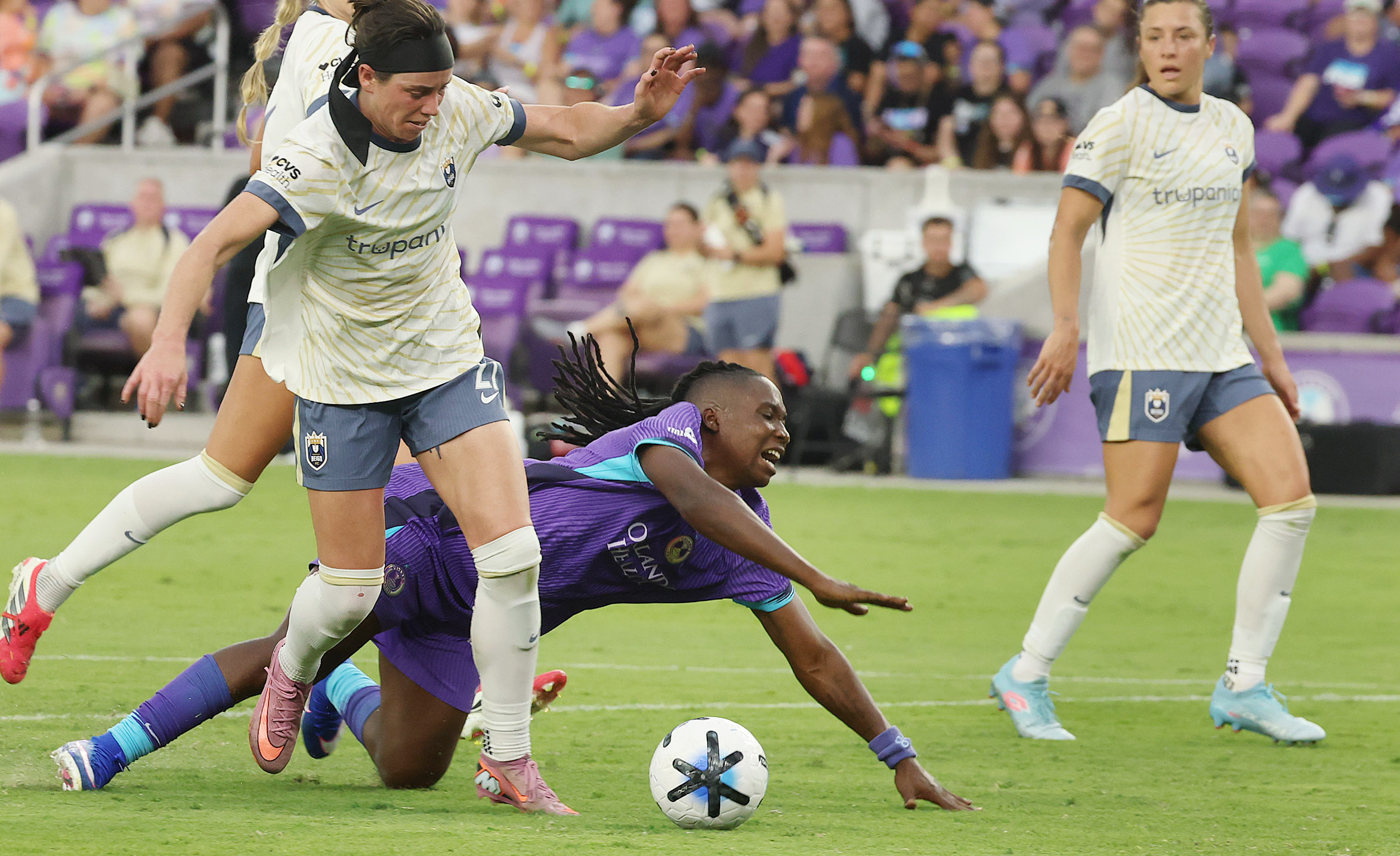 Orlando player Barbra Banda (bottom) falls during the Seattle Reign...