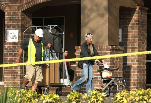 Items are removed from apartments at The Rialto apartments in Orlando on Tuesday, March 24, 2026. The Rialto apartments building had to be evacuated Thursday, March 19, after signs of structural instability were found. Residents are still unable to return. (Stephen M. Dowell/Orlando Sentinel)