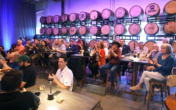 Attendees applaud during a discussion about sports in Central Florida at Forward/Slash Distillery & Blending House in Winter Park on Wednesday, March 25, 2026. (Stephen M. Dowell/Orlando Sentinel)