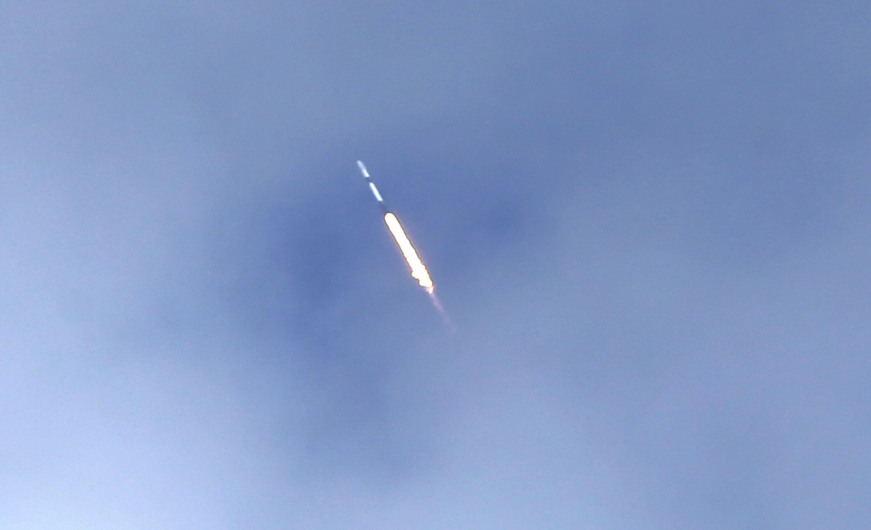 A SpaceX Falcon 9 rocket using a fleet-leading booster for...