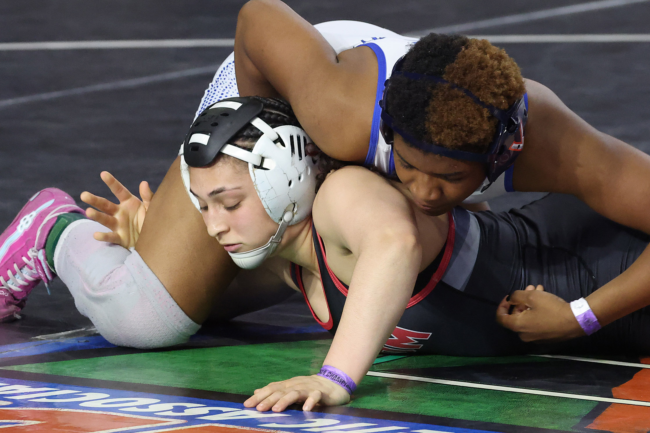 Freedom High's Paola Ramirez, bottom, tries to escape from South...