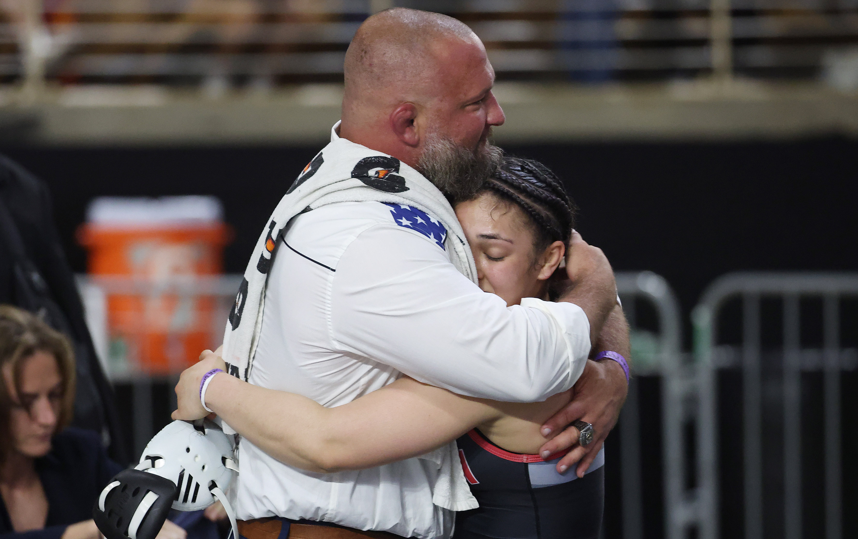 Freedom High's Paola Ramirez is consoled by assistant coach Michael...