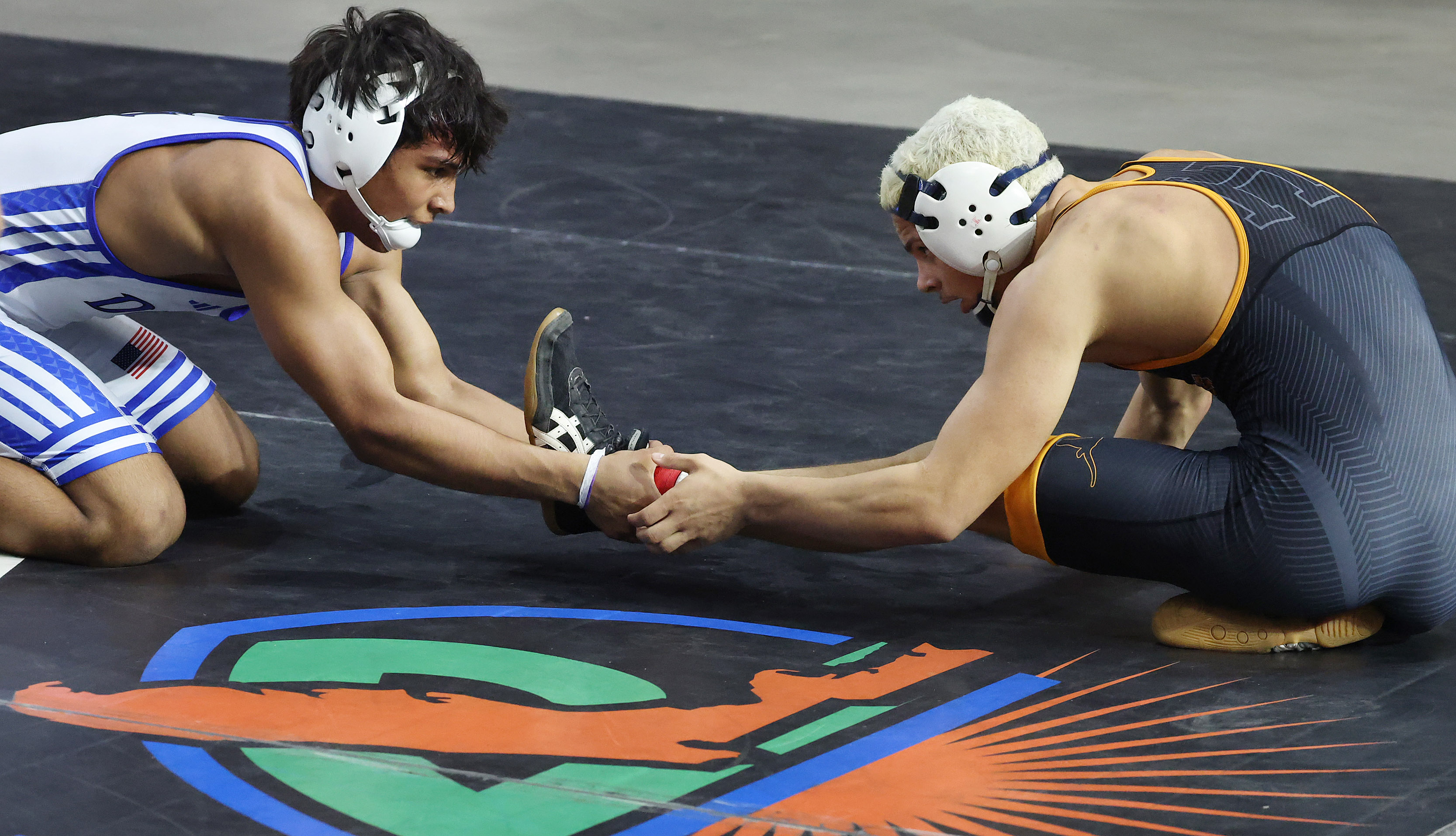Harmony High's Nathan Barrett, right, wrestles South Dade's Armand Williams...