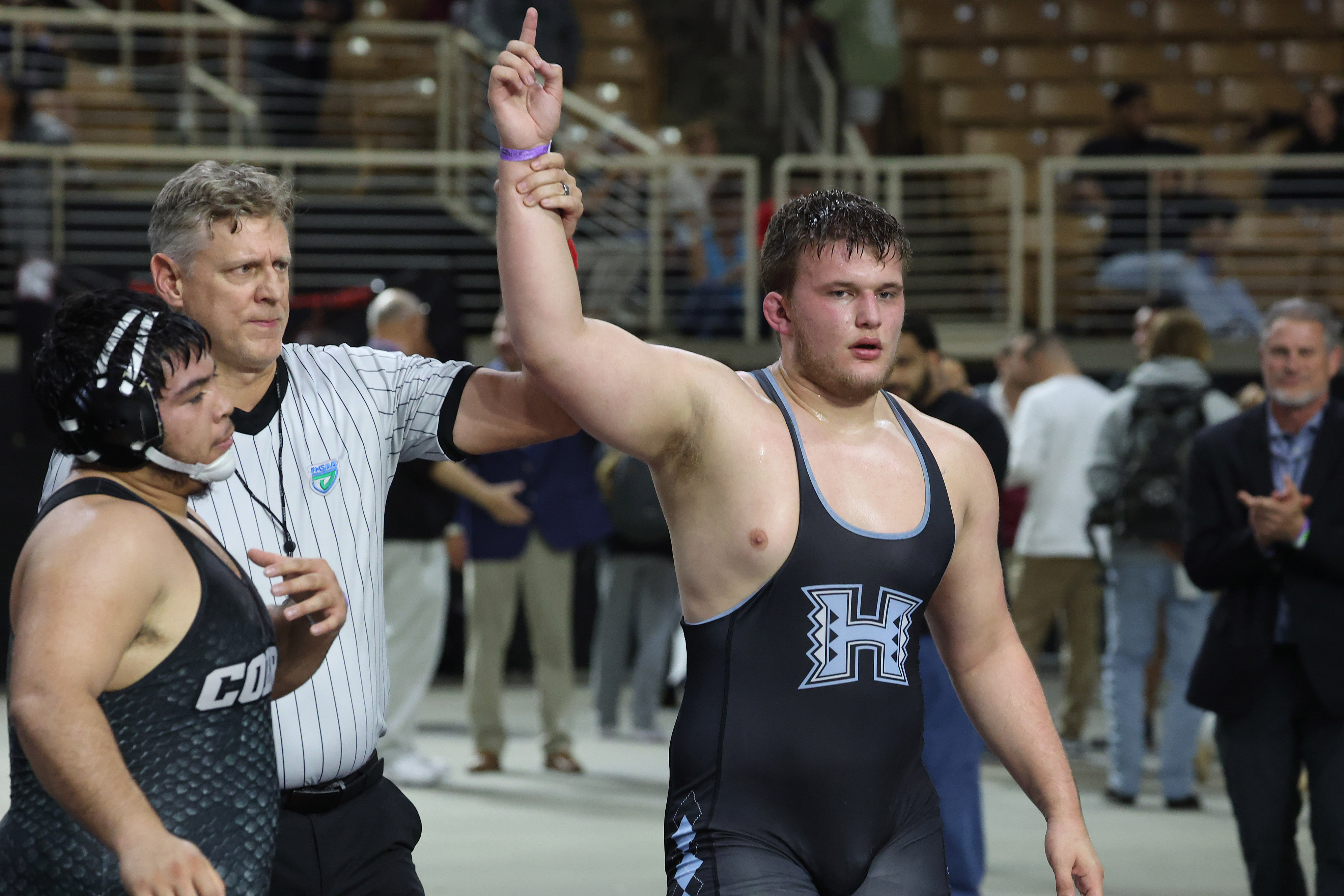 Hagerty High's Renzo Colligan is declared the winner during the...