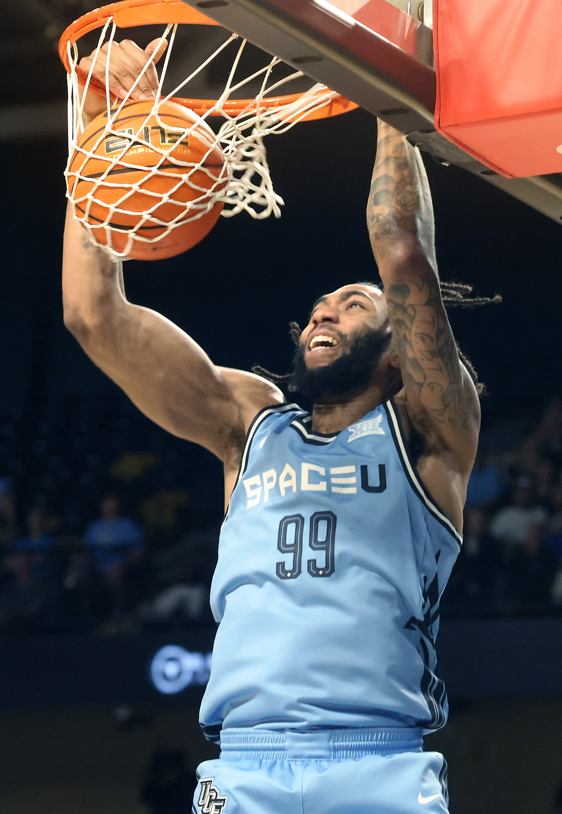 UCF forward Jordan Burks slam dunks during the Oklahoma State...