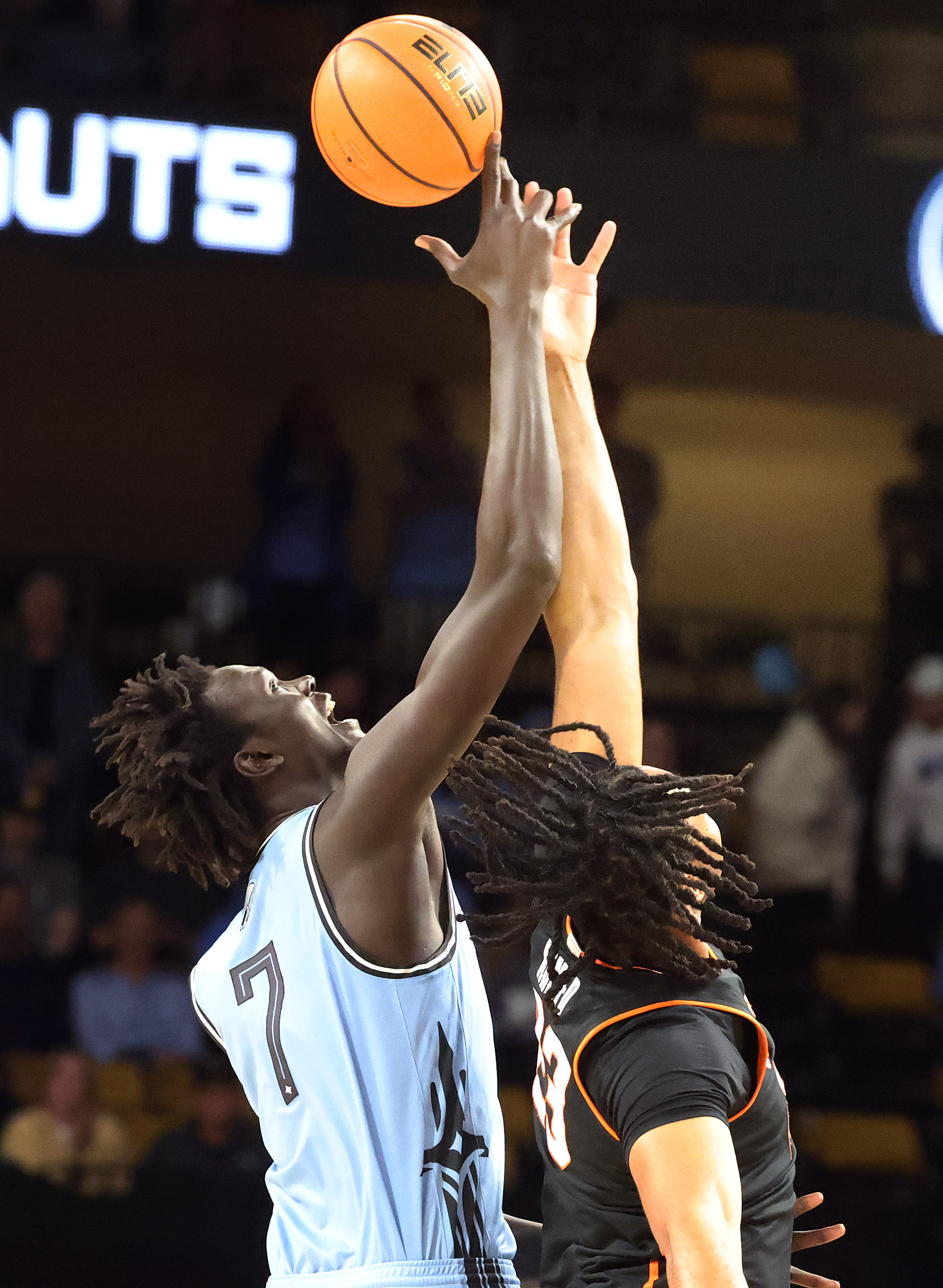 UCF center John Bol (7) and Oklahoma State center Benjamin...