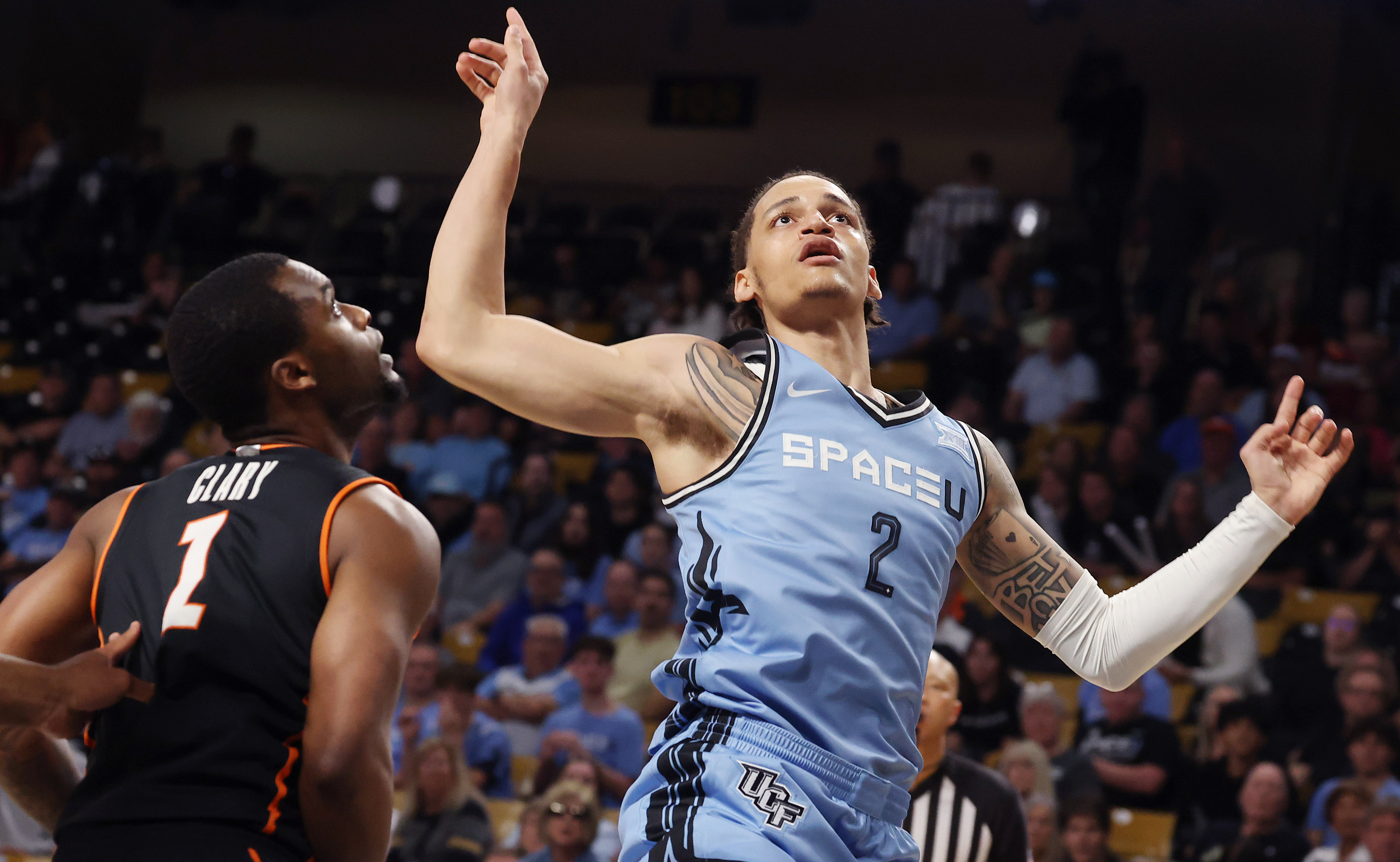 UCF guard Riley Kugel (2) finishes a shot over Oklahoma...