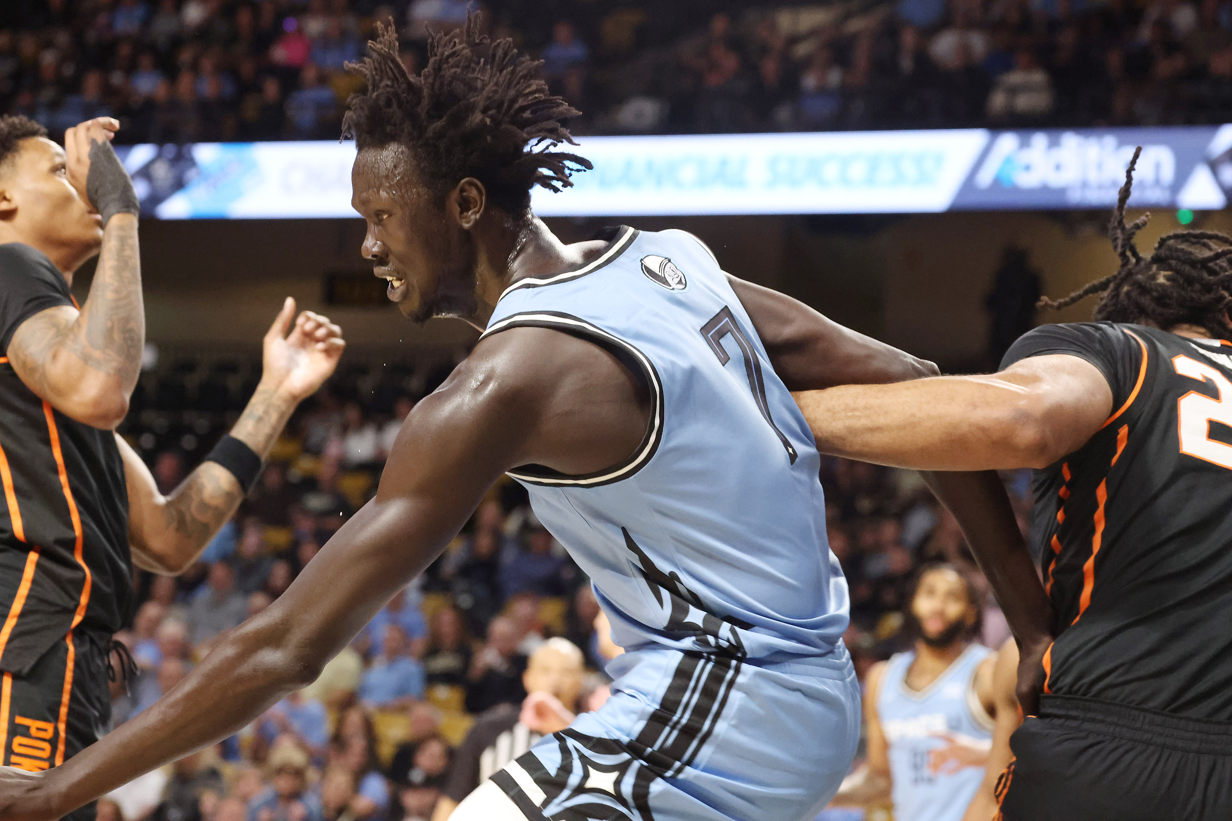 UCF center John Bol (7) pushes and shoves in the...