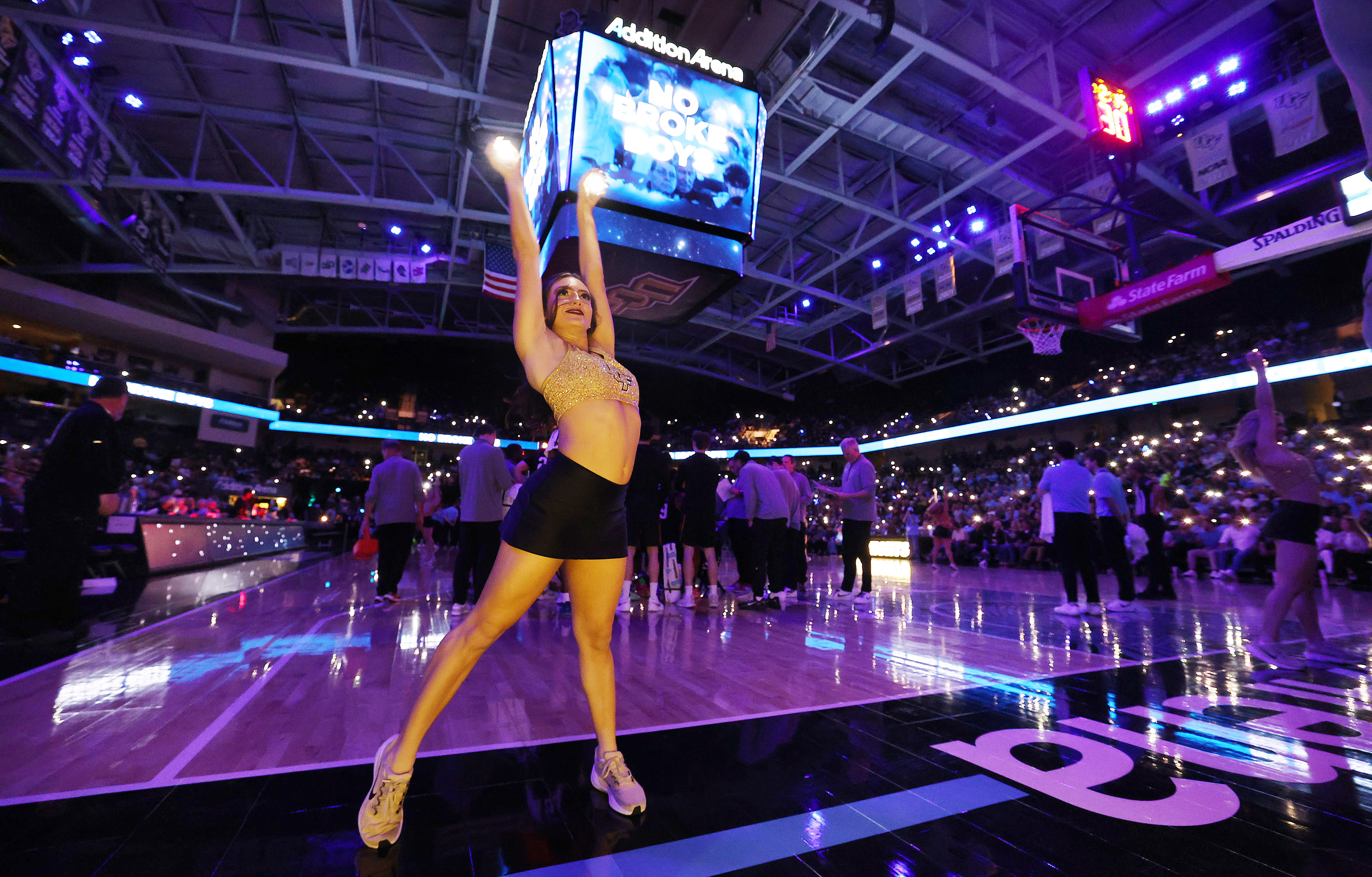 UCF cheerleaders perform during the Oklahoma State at UCF college...