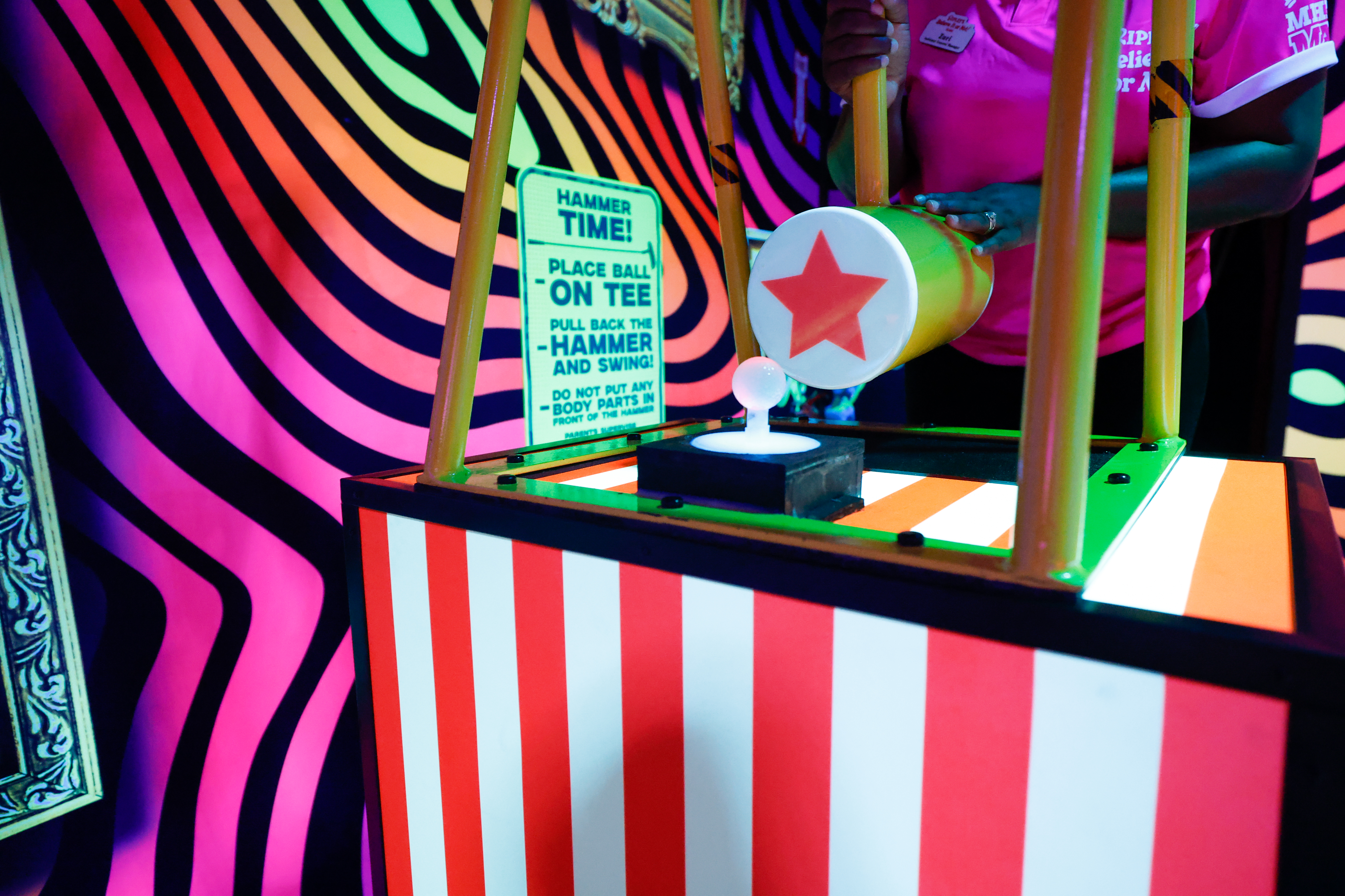 A test-your-strength, midway-style challenge with a hammer is one of...