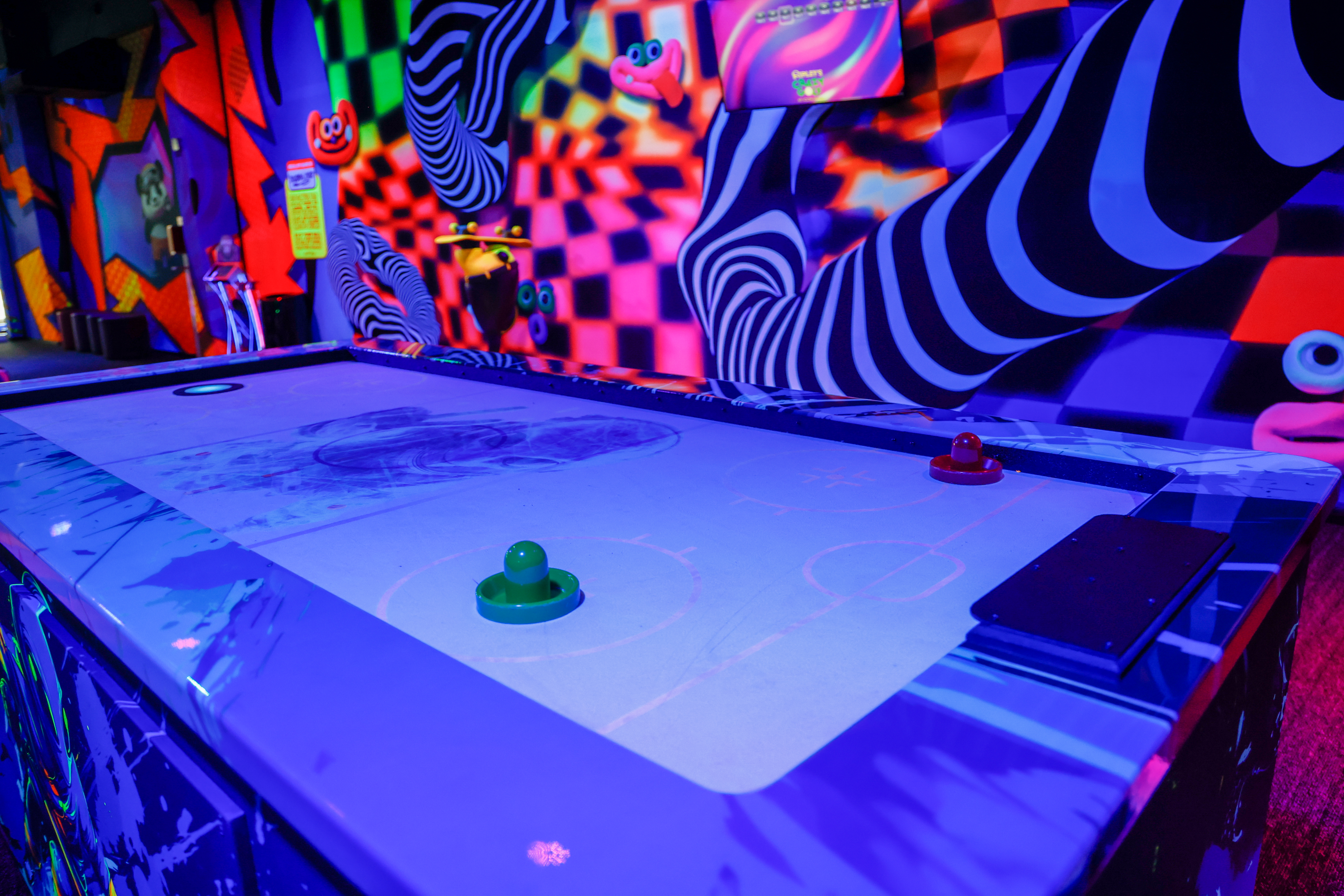 An air-hockey-inspired hole on the course at Ripleyâs Crazy Golf...