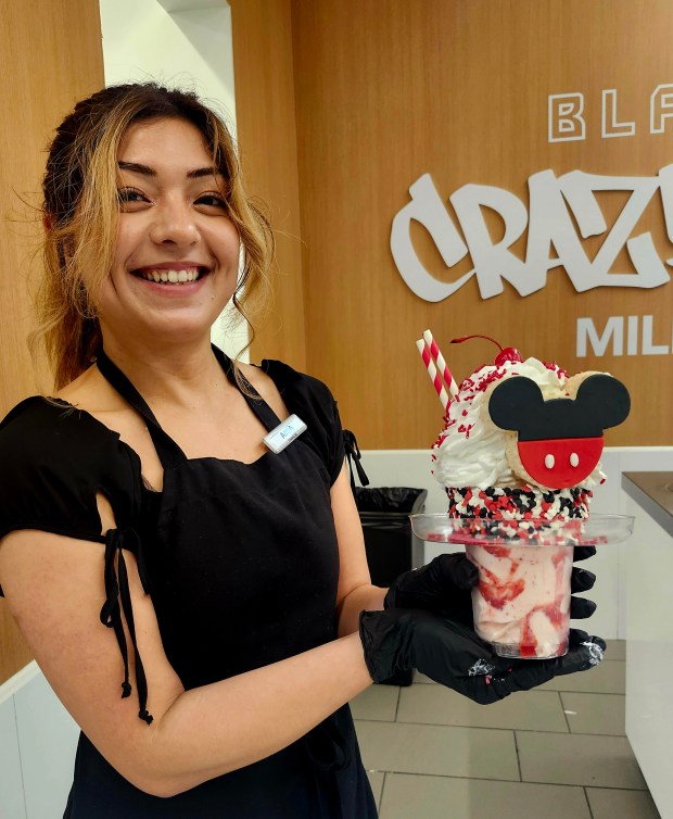 Cast Member Aria perfects the art of the Special Edition Mickey Shake at the BlackTap CrazyShake pop-up at Disney Springs. (Amy Drew Thompson/Orlando Sentinel)