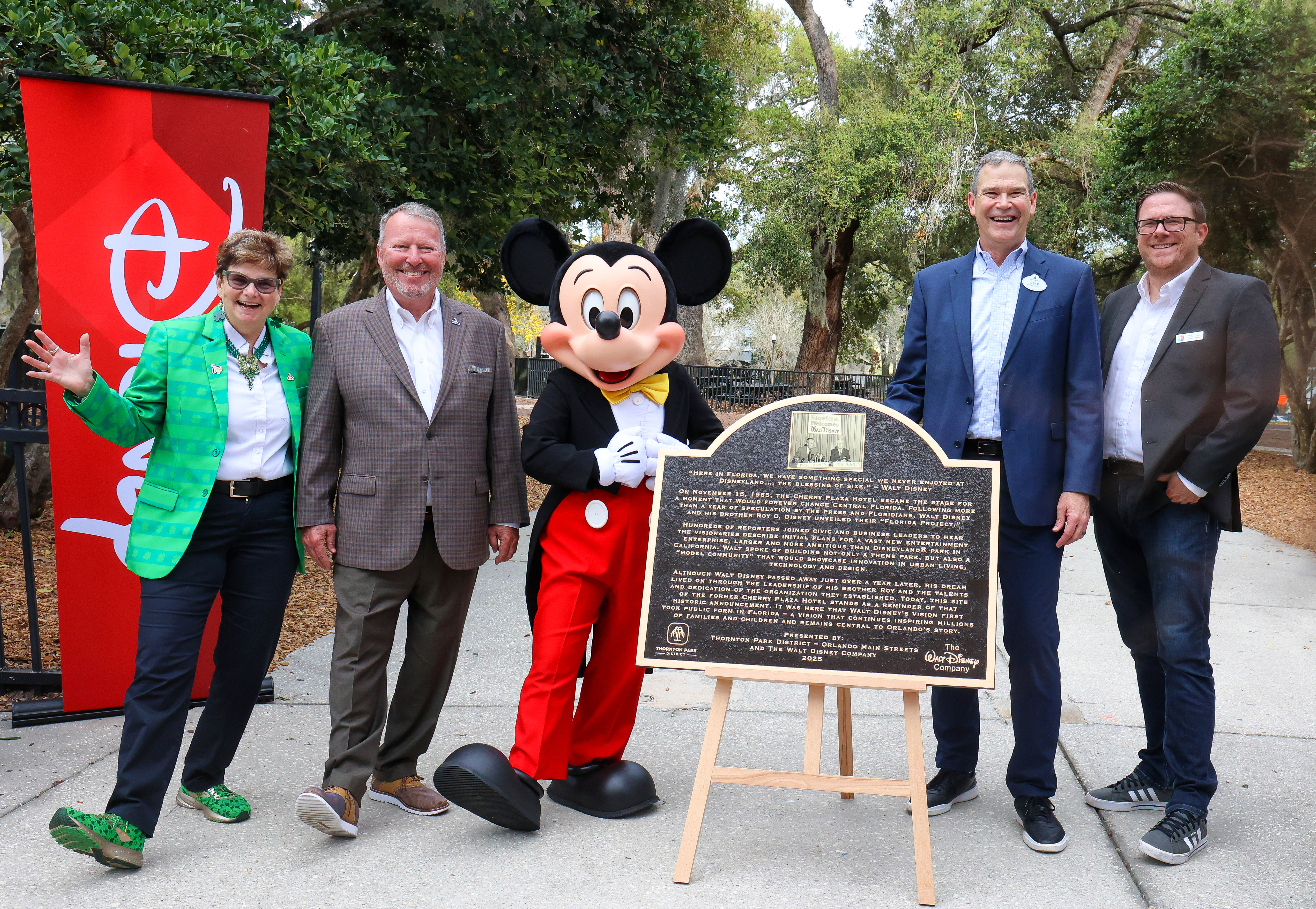 Walt Disney World President Jeff Vahle, second from right, celebrates...