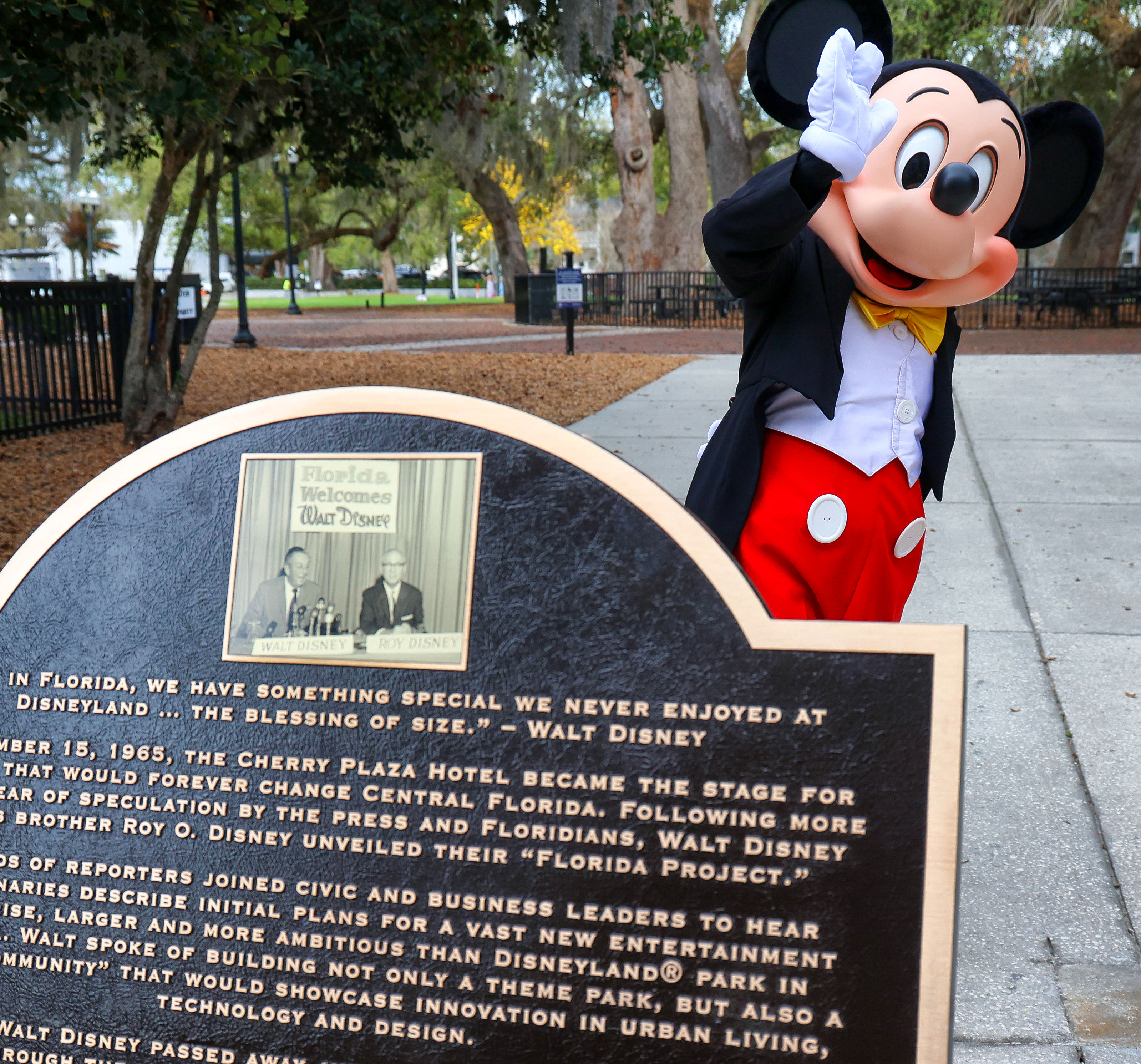 Mickey Mouse waves goodbye after helping unveil the plaque commemorating...