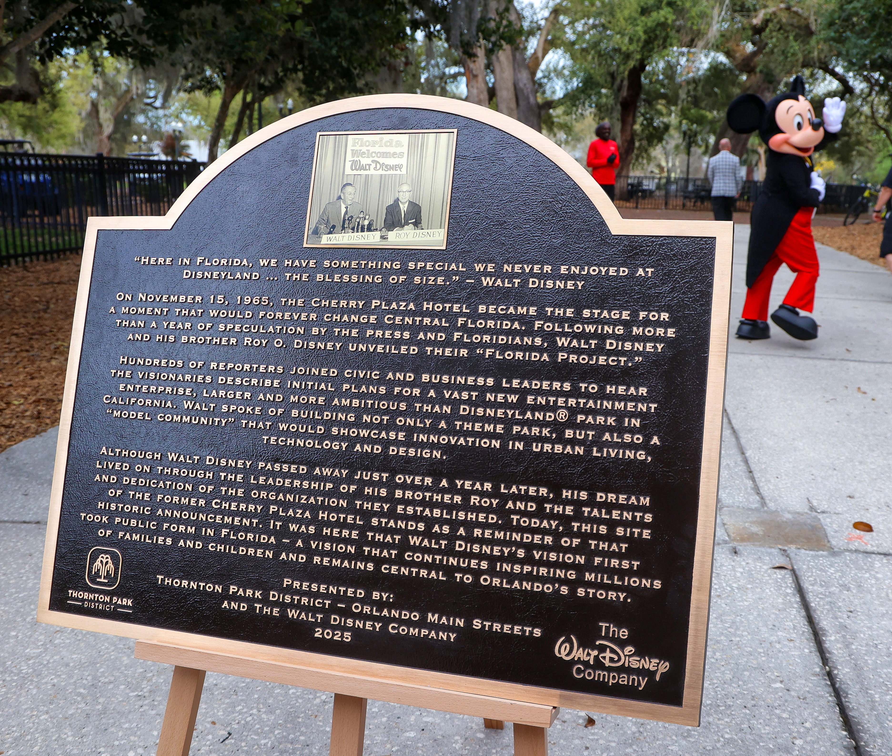 Mickey Mouse waves goodbye after helping unveil the plaque commemorating...