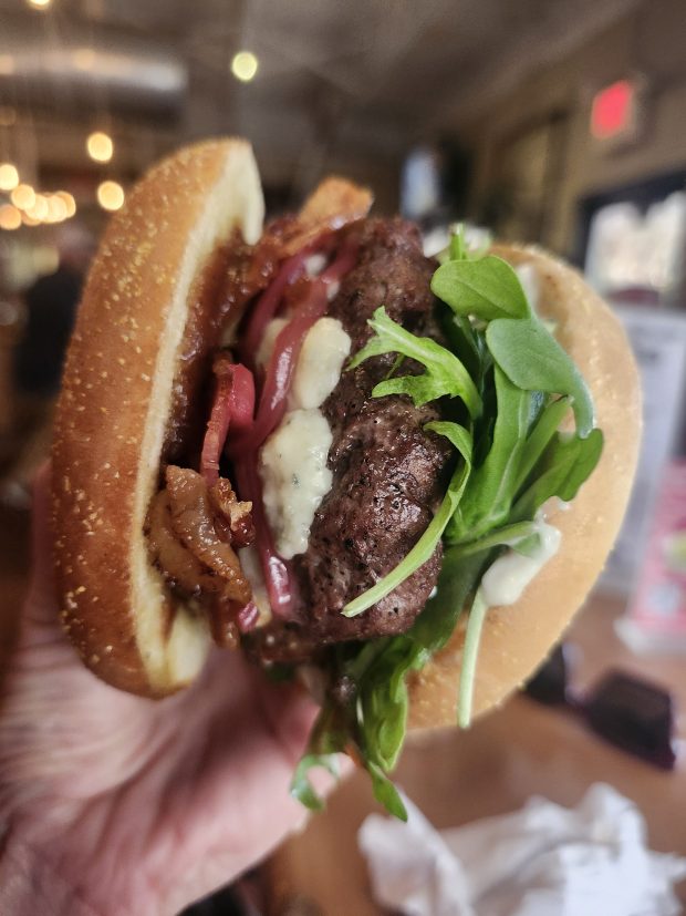 Ten 10's Bacon & Bleu is Big Green Egg-smoked before it gets it's hot skillet sear. (Amy Drew Thompson/Orlando Sentinel)