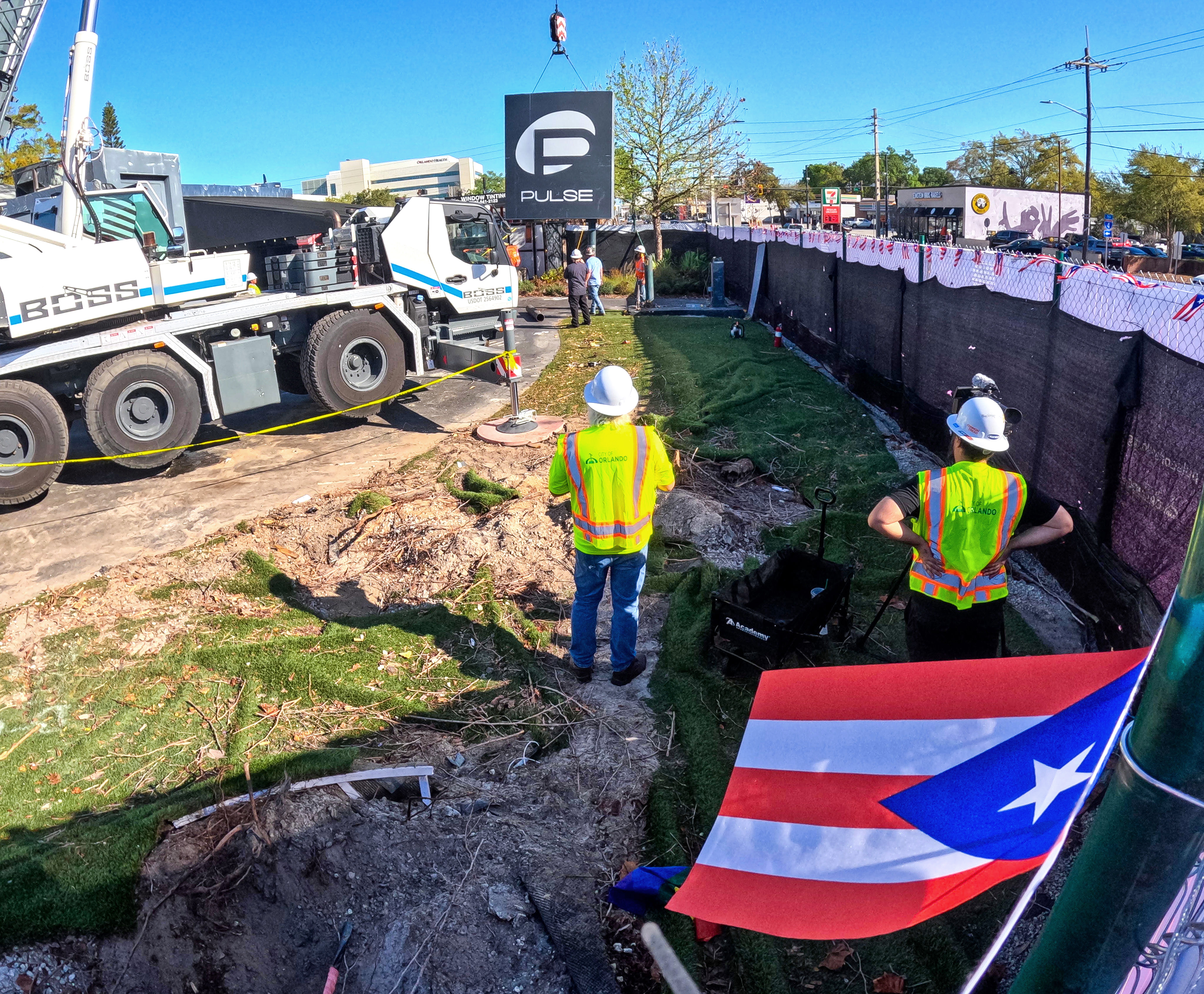 A Puerto Rican flag banner waves as the sign for...