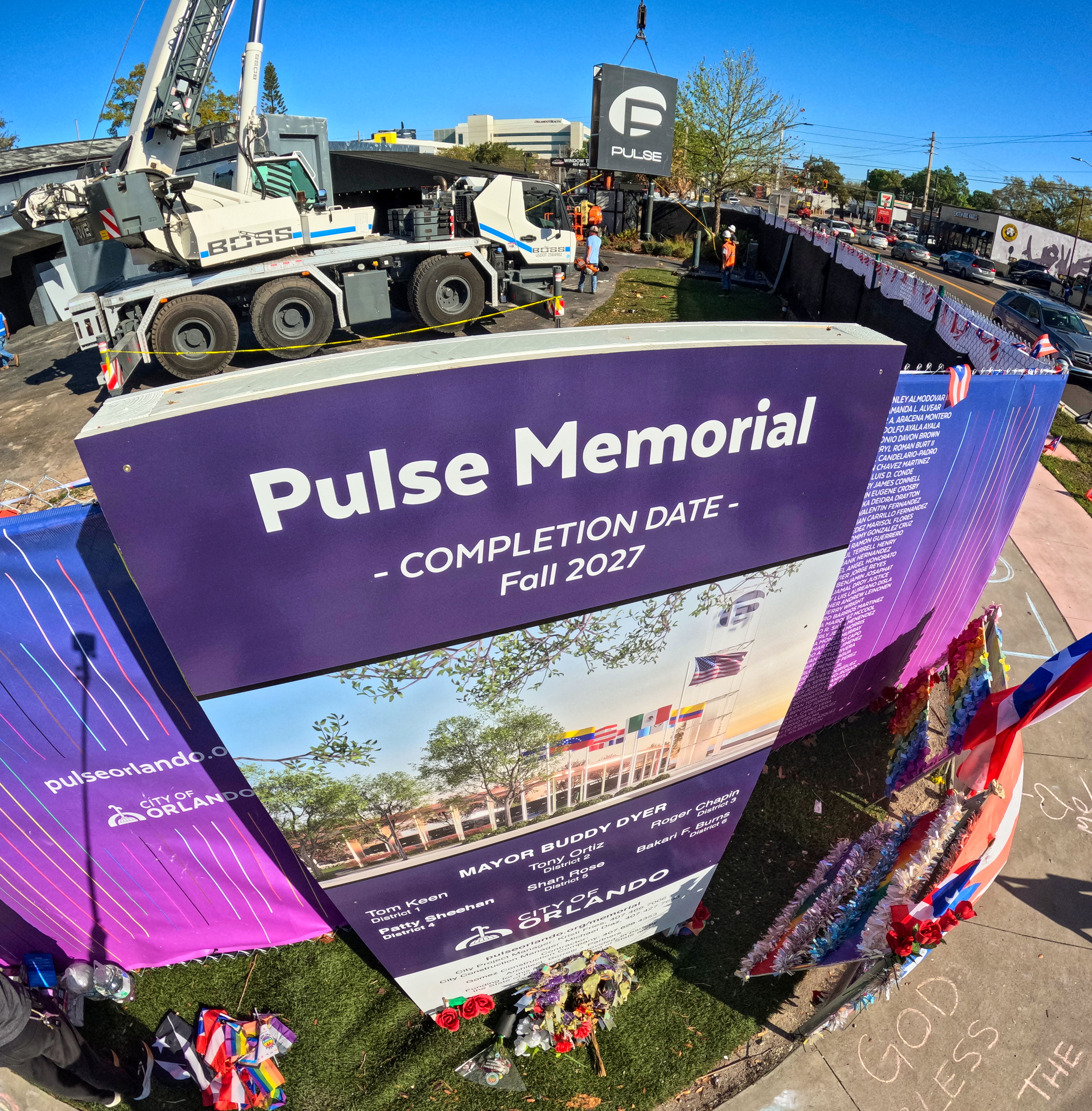 The sign for the Pulse nightclub is removed by workers,...