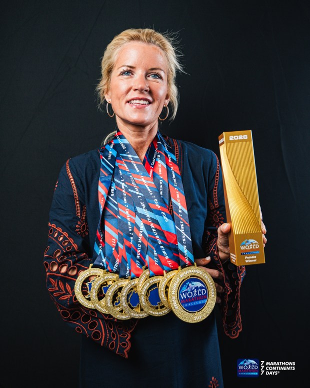 Orlando resident Beth Reed shows off her medal collection following the World Marathon Challenge, which had runners completing seven marathons in as many days on all seven continents. (Max Moody/Courtesy of World Marathon Challenge)