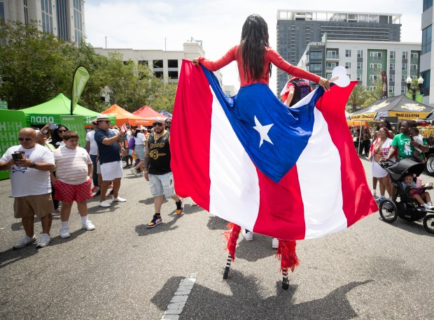 The Florida Puerto Rican Parade and Festival attendees celebrated Puerto Rican culture, heritage, values, and its contributions to the State of Florida on the downtown streets of Orlando, Fla., Saturday, April 26, 2025. (Willie J. Allen Jr./Orlando Sentinel)