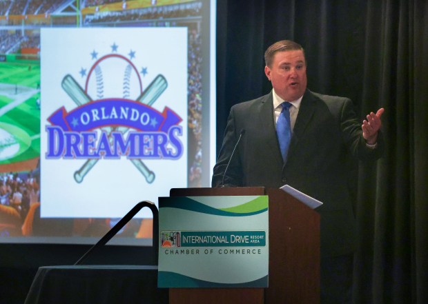 A rendering of stadium plans is projected during the Orlando Dreamers prospective MLB ownership group's presentation to the I-Drive Resort Area Chamber of Commerce, with moderator and former state House representative Bobby Olszewski, at the Hilton Orlando, Monday, June 16, 2025. (Joe Burbank/Orlando Sentinel)