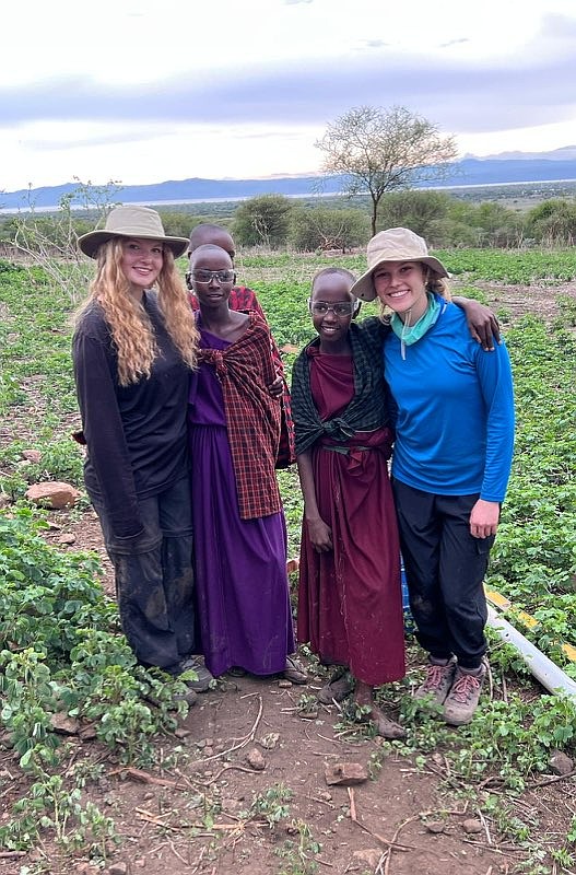 Senior Maycee Walsh, left, and junior Lacey Farrell, right, loved making connections with the Maasai children.