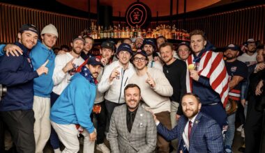 photo of the U.S. Men’s Hockey Team huddling for a photo inside a club