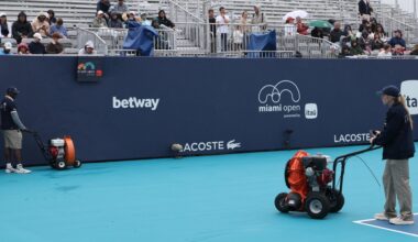 Mar 18, 2026; Miami Gardens, FL, USA; Workers dry Butch Buchholz Court during a rain delay on day 2 of the 2026 Miami Open at Hard Rock Stadium.
