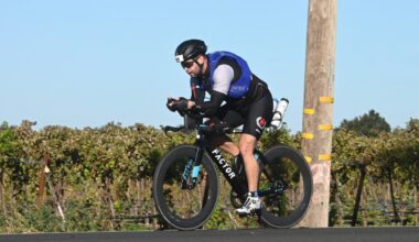 Chris McVety competes in the cycling portion of an Ironman race in full racing gear