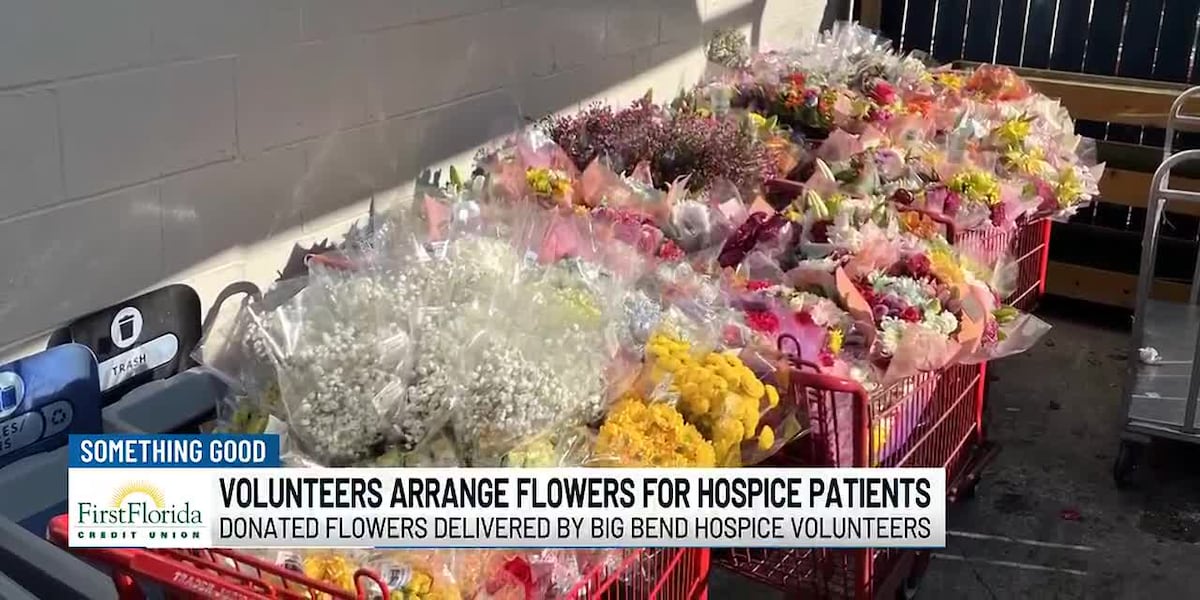 Volunteers arrange flowers for hospice patients