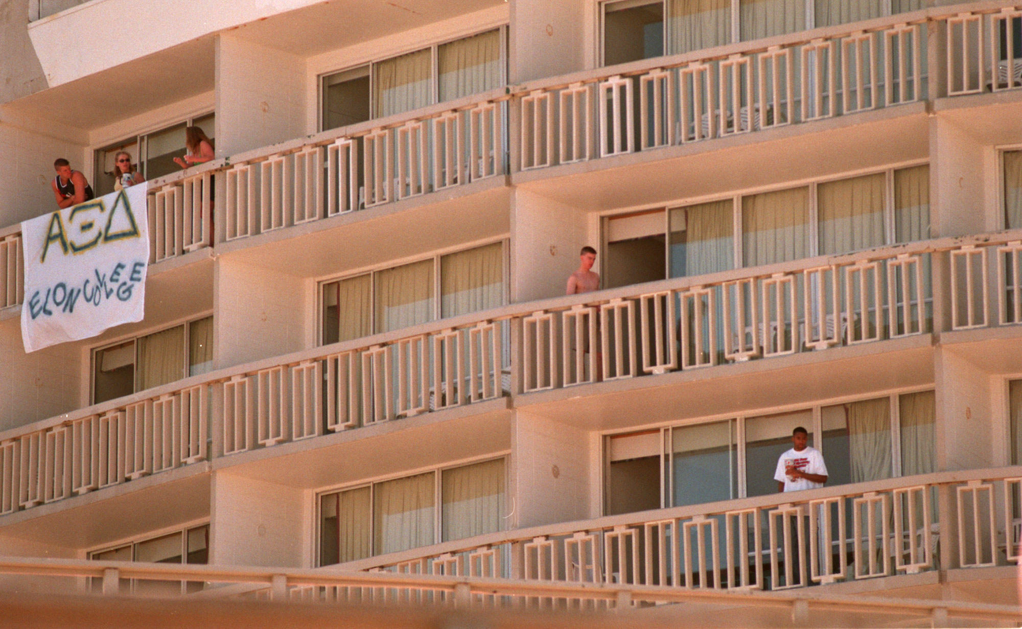 Spring Breakers still hang out on the balconies at the...