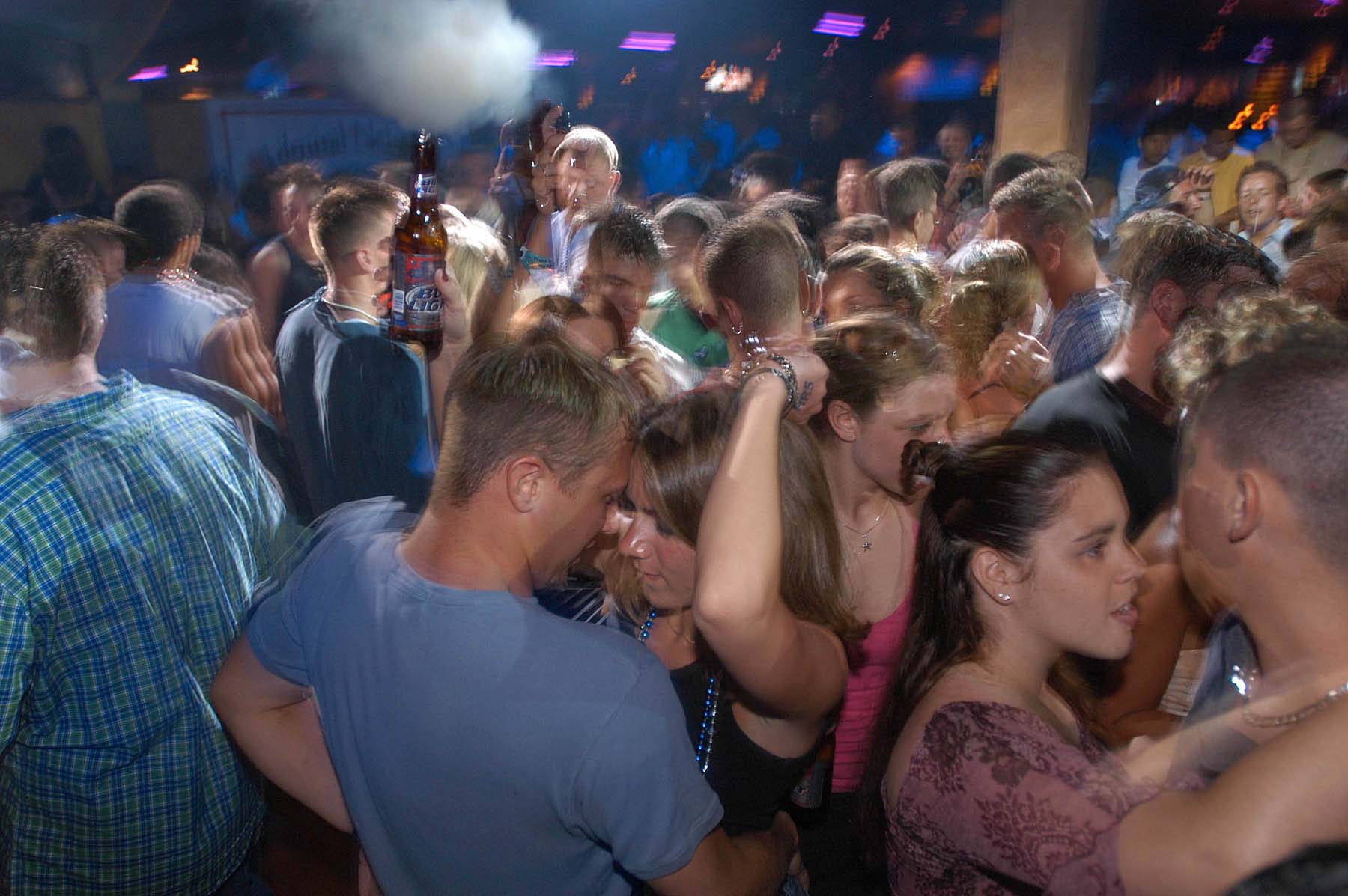 Spring Breakers party on a packed dance floor at Razzle's...