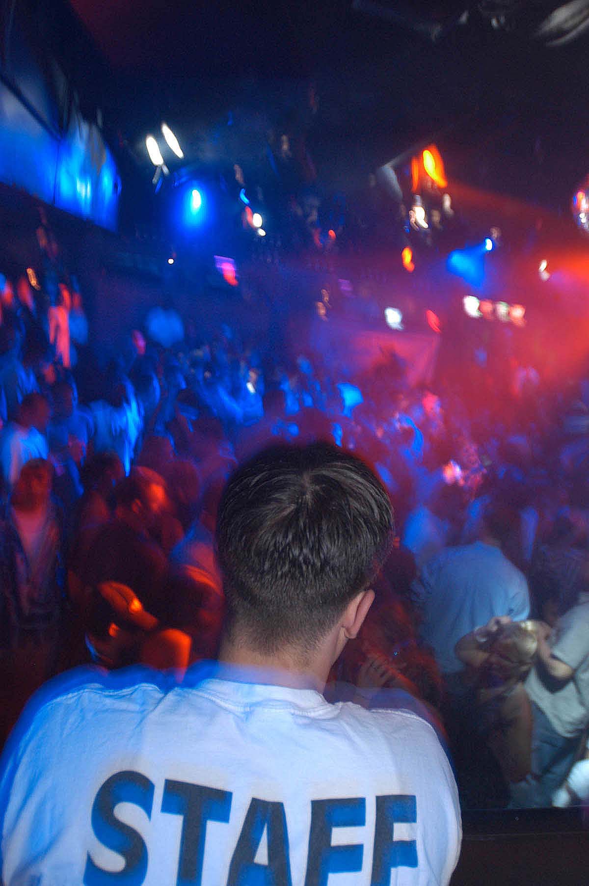 A staff member at Razzles nightclub in Daytona watches over...