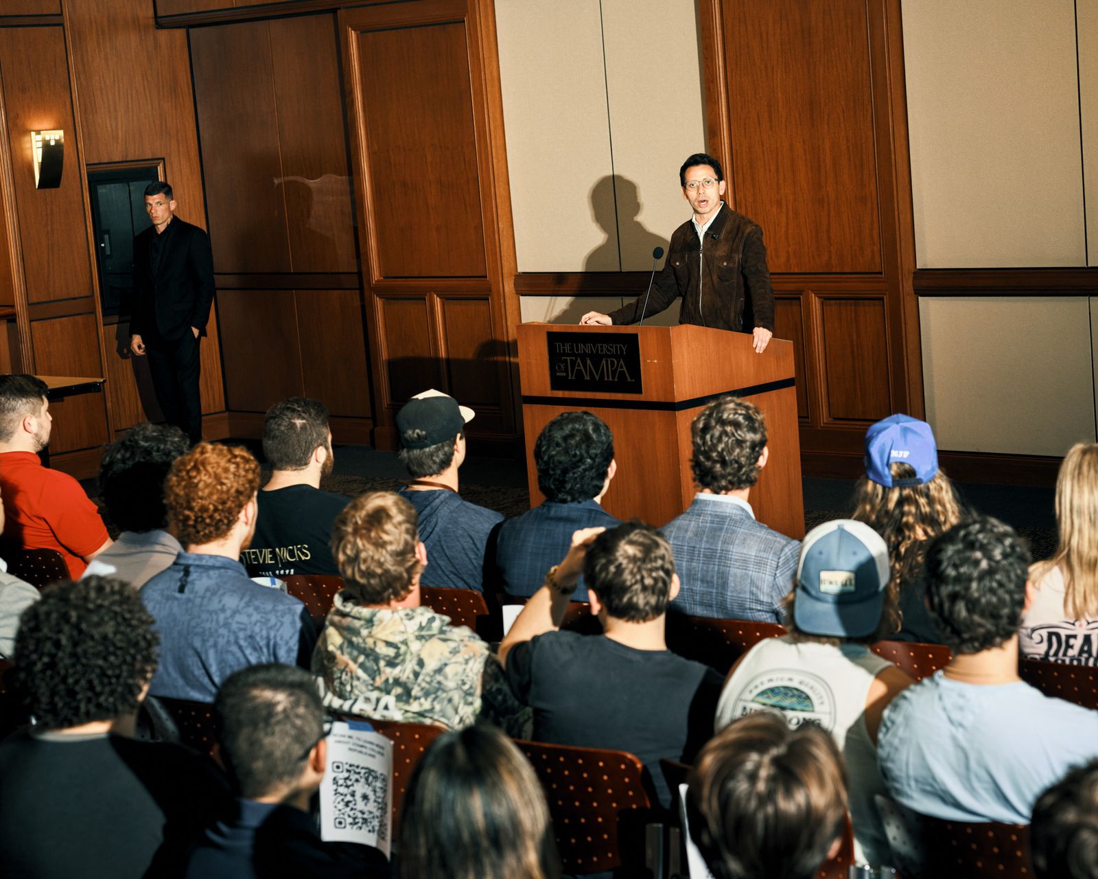 Image may contain Crowd Person Audience Adult People Child Speech Podium Face and Head