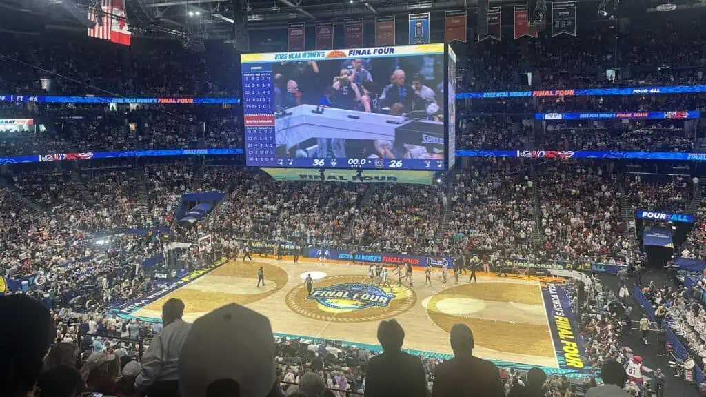 a basketball court with lights on it