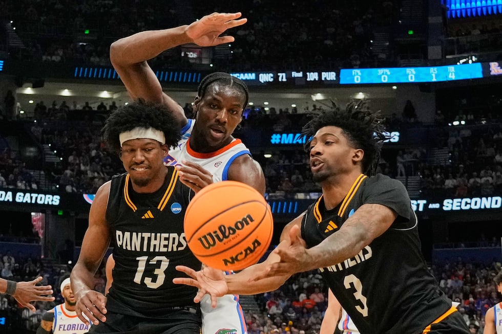 Prairie View A&M forward Cory Wells (13) and guard Tai'reon Joseph (3) get a rebound in front...