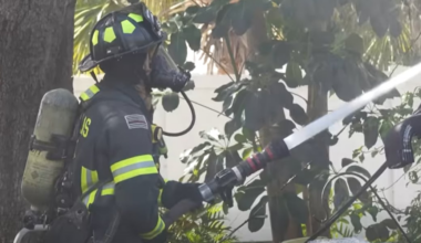 Police help resident escape burning duplex through window