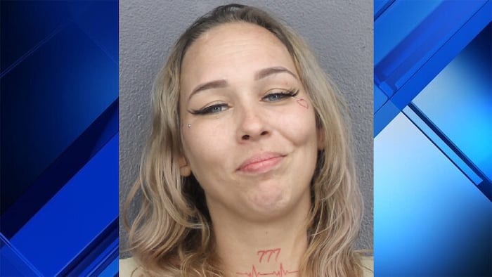 Broward woman grins in mugshot after shooting sister, cops say